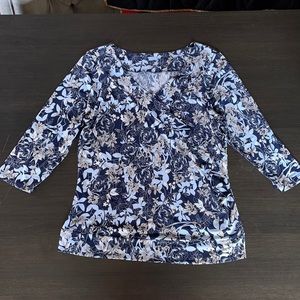 Blue floral pattern shirt.  3/4 sleeve. Flattering